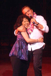 David gives Joyce a hug after being Lei'd