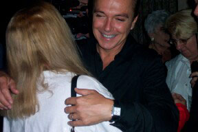David gives Nancy a hug.
