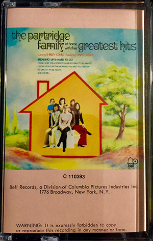 At Home with their Greatest Hits Cassette Front cover.
