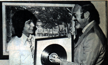 David receiving a Gold Record award.