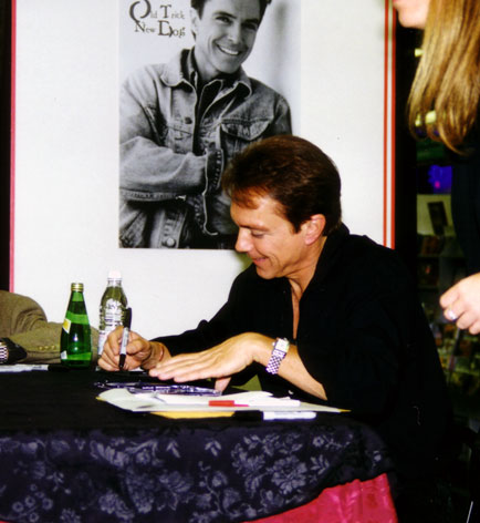 David autographs a CD