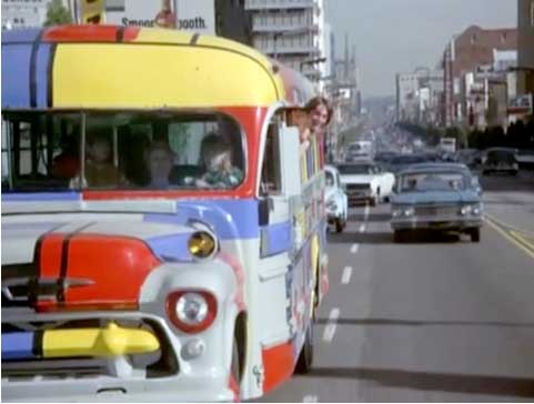 Shirley driving The Partridge Family Bus