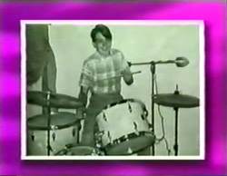 David playing drums at school